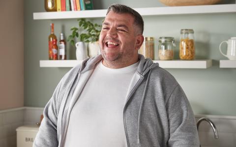 Male Smiling In Kitchen Environment