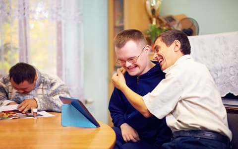 Adult Men With Down Syndrom Laughing Together