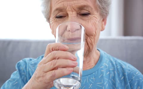 Elderly Woman Drinking Water