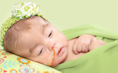 Baby With Feeding Tube In Nose Laying Down