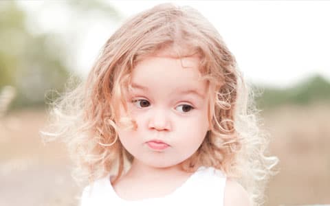 FPortrait Image Of Young Child With Blond Curly Hair