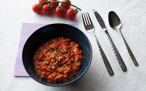 Food In Bowl On Table With Cutlery