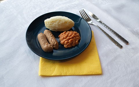 Food On Plate With Cultery On Table